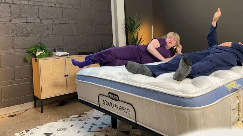 Our testers lying atop the Bear Star Hybrid mattress as part of our team's motion isolation examinations