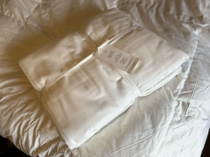 A folded Boll & Branch Flannel Sheet Set