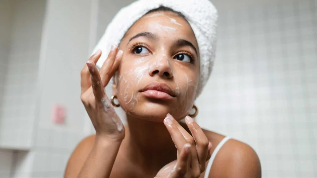 Woman cleansing skin
