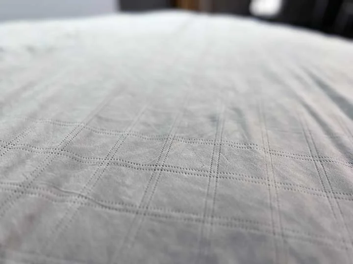 A close up shot of the Puffy Weighted Blanket, showing off its fuzzy minky texture.