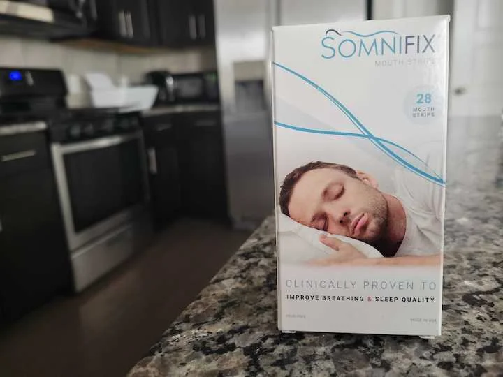 a package of mouth tape strips sits on a counter