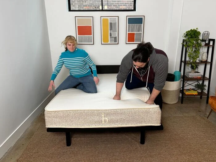 two testers getting into the birch natural mattress