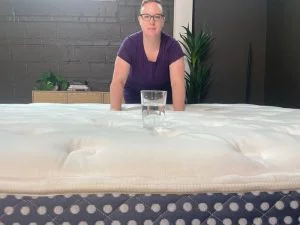 Tester performing the ripple test on The Winkbed luxury firm model