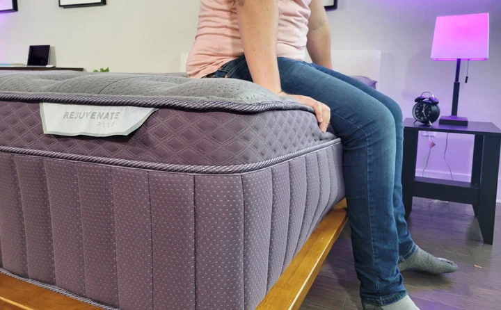 A man sits near the edge of the Purple RejuvenatePlus