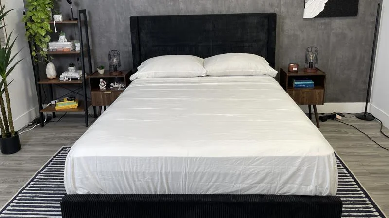 A bed made up with a new set of PlushBeds Bamboo Sheets