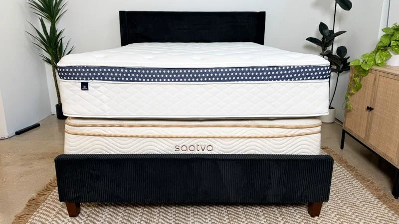 Front view of a WinkBed mattress on top of a Saatva Classic mattress