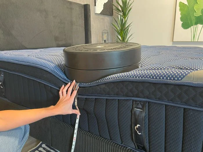 Weights are used to check sinkage on the DreamCloud Luxe Memory Foam mattress