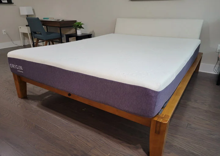 A wide shot of the Polysleep Origin on a wooden bed frame