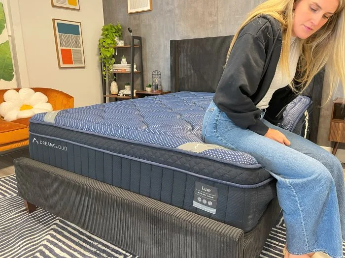 Our tester sits at the bottom of the DreamCloud Luxe Memory Foam mattress
