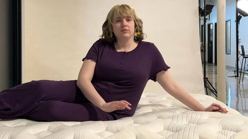 Our tester lying atop the Bear Star Hybrid mattress