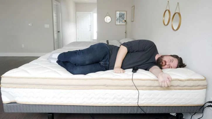 A man sleeps on his side. A man sleeps on his side.