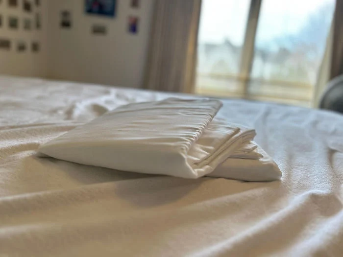 Folded Silk & Snow Organic Cotton Sheets