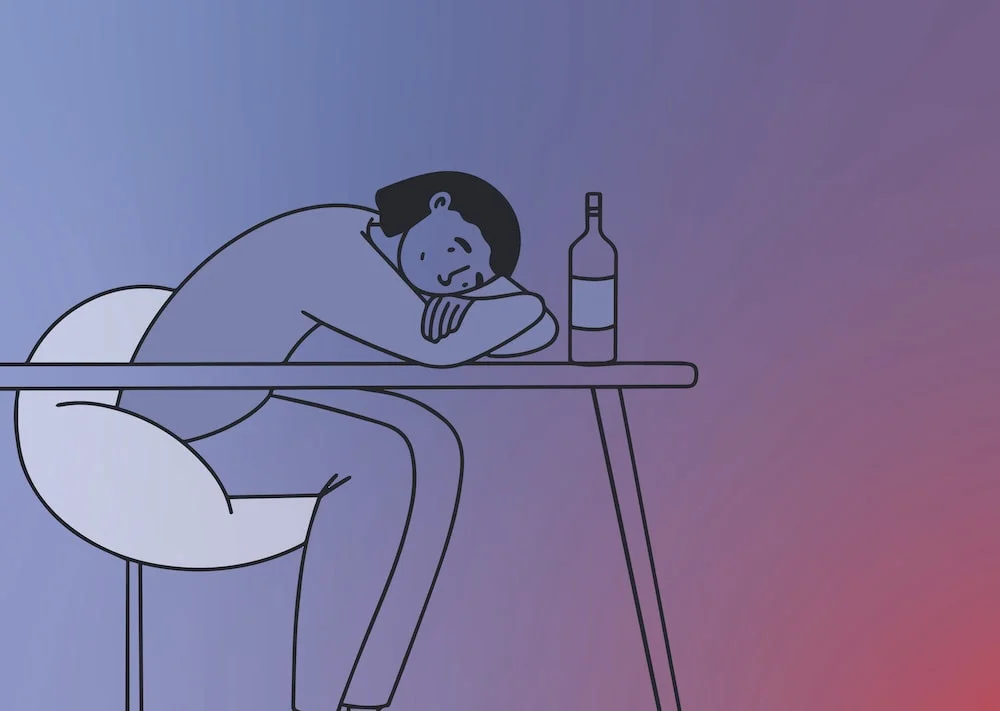 person feeling sad with bottle of alcohol