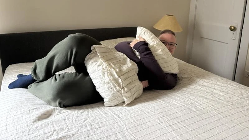 Cozy pose with a set of Silk & Snow Flax Linen Sheets