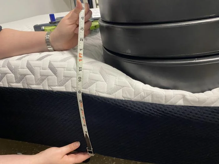 Measuring the deflection of weight plates on the edge of the Nectar Premier Memory Foam