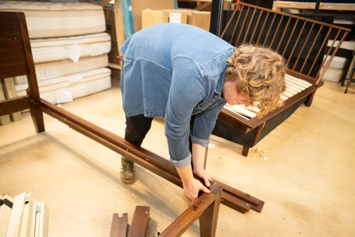 Our tester Matt Schickling assembling the corner joints of a Big Fig Platform Bed.