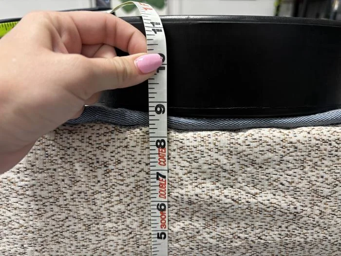 Measuring weight plates on the edge of a Birch Kids Mattress