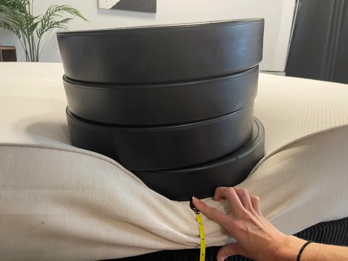 Measuring a lot of weight plates on the edge of a Boring Hybrid Mattress
