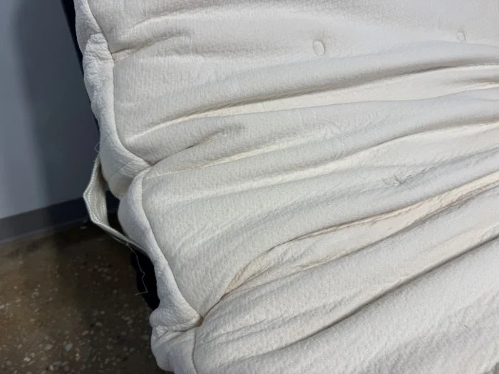 The Avocado Eco Organic mattress on an adjustable base