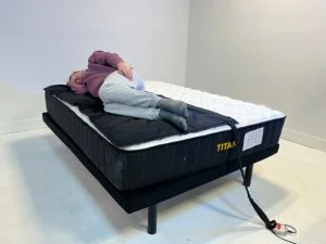 Heavy tester trying out the Titan Plus mattress in the side sleeping position to evaluate pressure relief