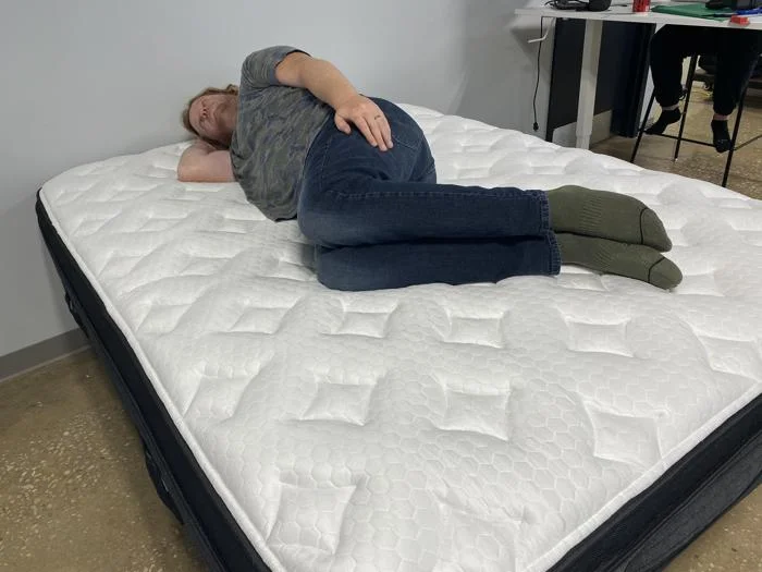 Our tester Side Sleeping on the Nolah Evolution Comfort Plus Mattress