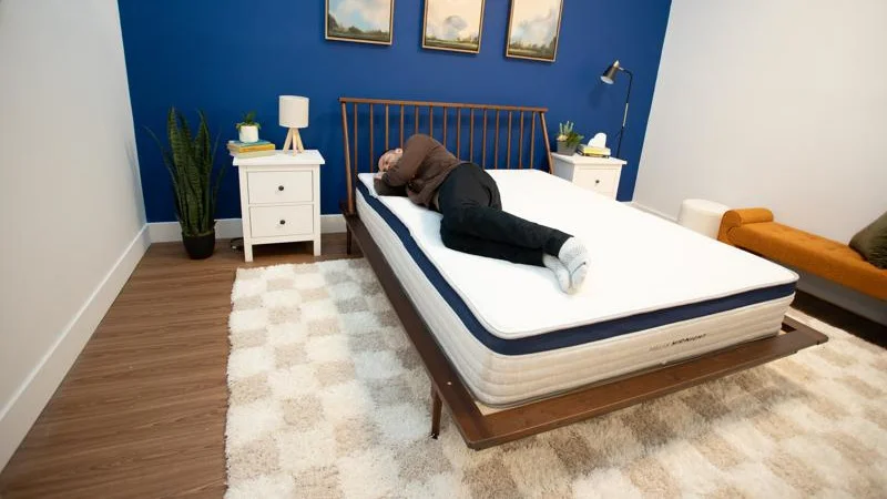 A person side sleeping on a Helix Midnight Mattress