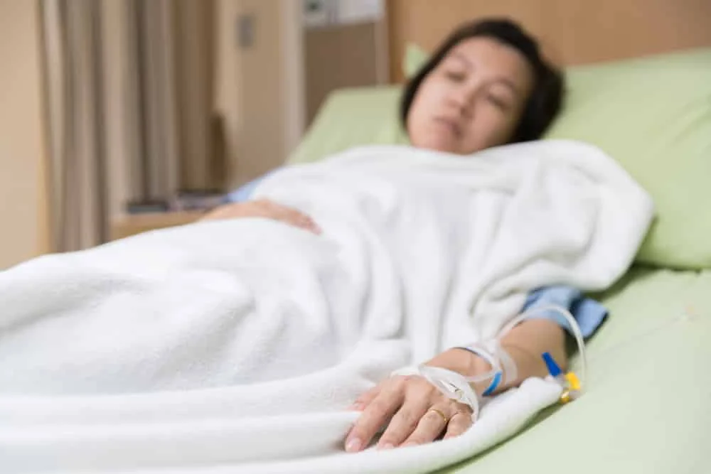 Do We Really Sleep Worse In The Hospital? A patient lies down in a bed.