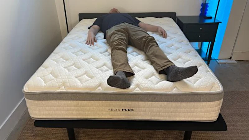Heavyweight tester back sleeping on the Helix Plus Mattress