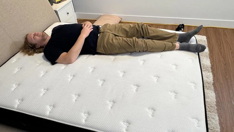 Our heavyweight tester Back Sleeping on the Titan Plus Luxe Mattress