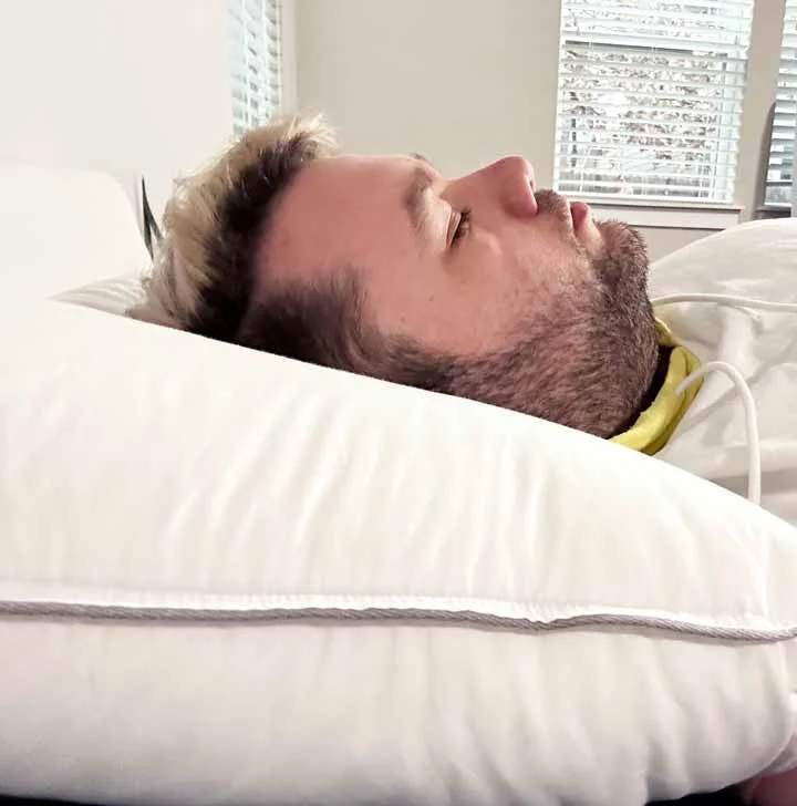 A man rests on his back with the Tuft & Needle Down Alternative Pillow. A man rests on his back with the Tuft & Needle Down Alternative Pillow.