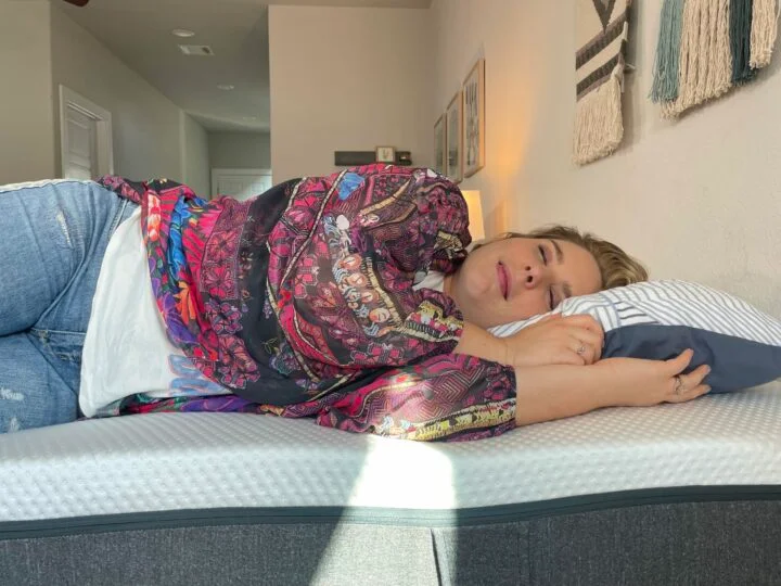 Does Magnesium Help You Sleep? A woman rests on her side on the Emma mattress