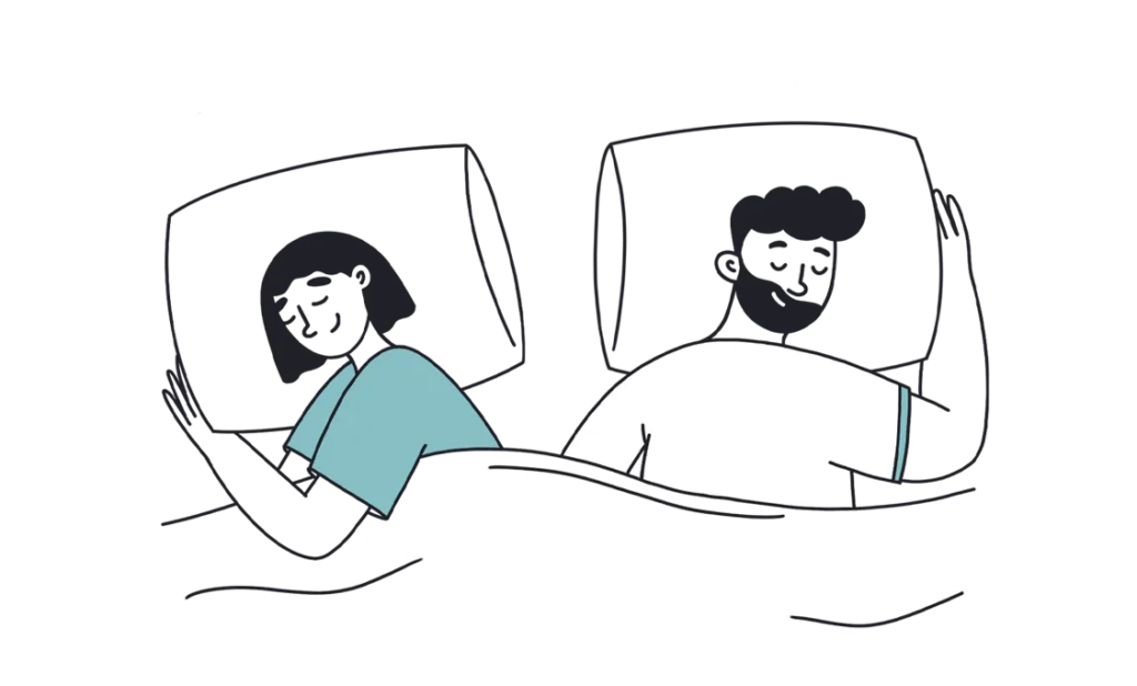 couple sleeping happily in bed