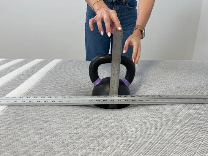 Measuring sinkage on the Leesa Original mattress using a kettlebell