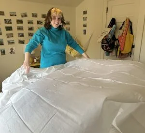 Our tester smiles after whipping out a Silk & Snow Egyptian Cotton Sheet