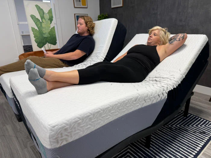 Two people resting on a Nectar Premier Adjustable Base with Nectar Premier Split King Mattresses