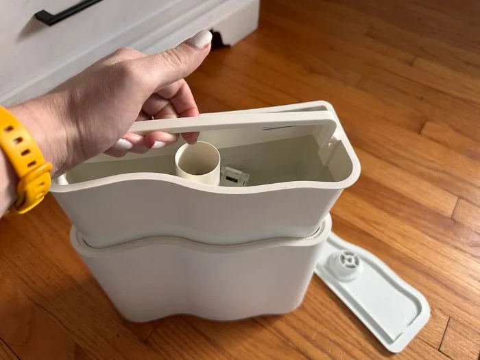 Looking inside a Vitruvi Humidifier at the reservoir and handle.