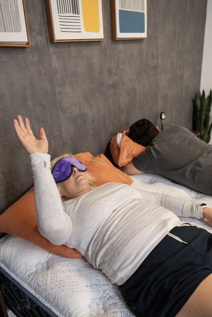 A couple of testers evaluate motion isolation on the Serta Perfect Sleeper Cascade Range Medium mattress