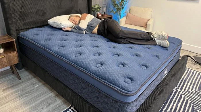 Our tester side sleeping on the Brooklyn Bedding Signature Hybrid Mattress