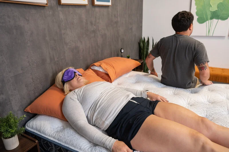 A couple of testers evaluate motion isolation on the Serta Perfect Sleeper Cascade Range Medium mattress