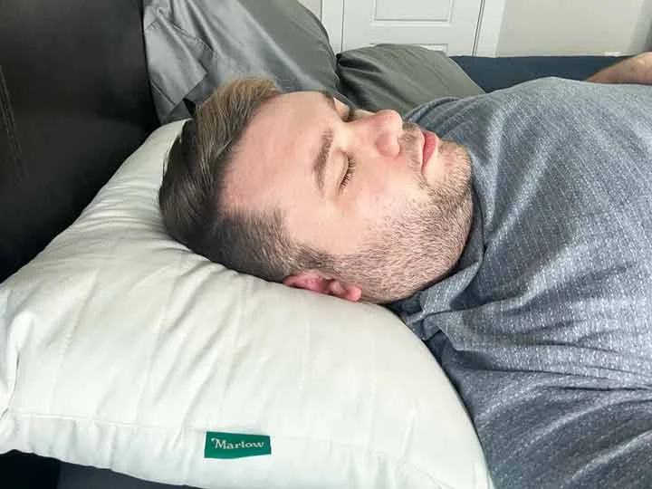 A man sleeping on his back with the Marlow pillow. A man sleeping on his back with the Marlow pillow.