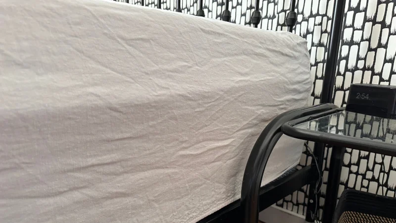 Side view of Parachute Home Linen Sheets on a bed