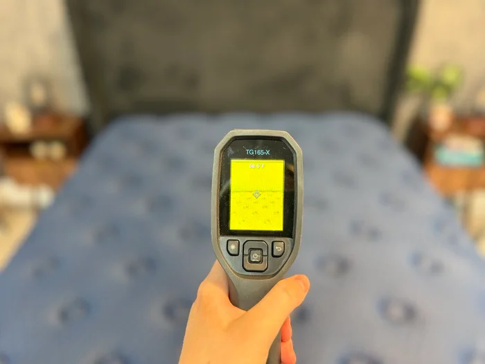 A thermal gun aimed at the surface of the Brooklyn Bedding Aurora Luxe mattress
