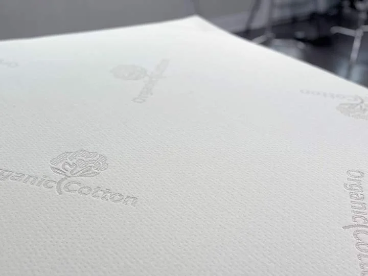 An image showing the cotton cover of the Brooklyn Bedding Latex Topper