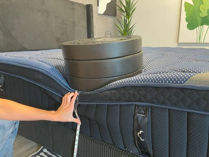 Weights are used to check sinkage on the DreamCloud Luxe Memory Foam mattress