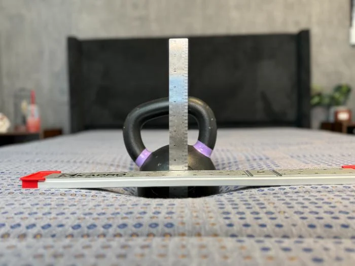 Performing the sinkage test on the Copperflex Memory Foam mattress