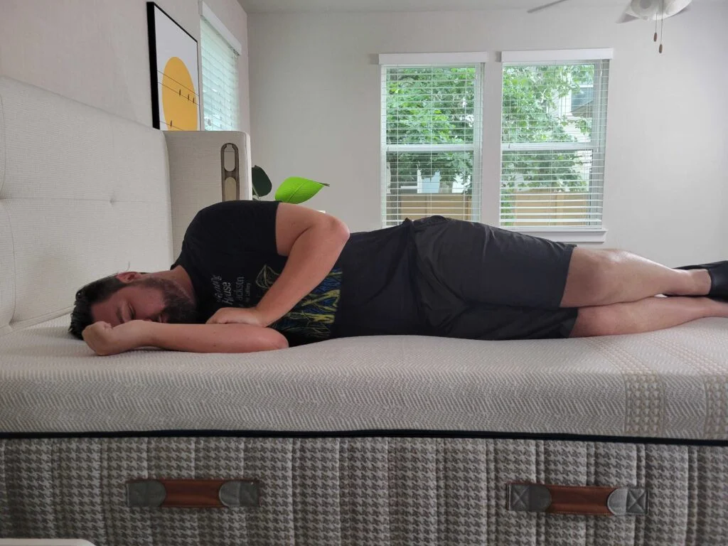 a man sleeps on his side on the Leesa Reserve mattress