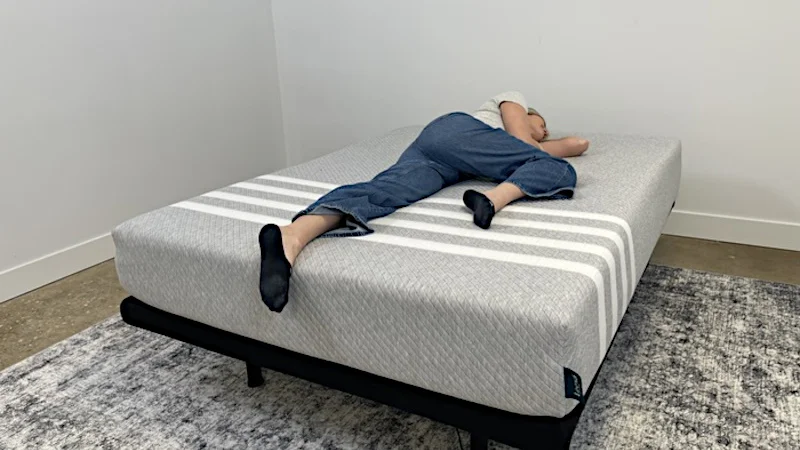A person side sleeping on a Leesa Original mattress