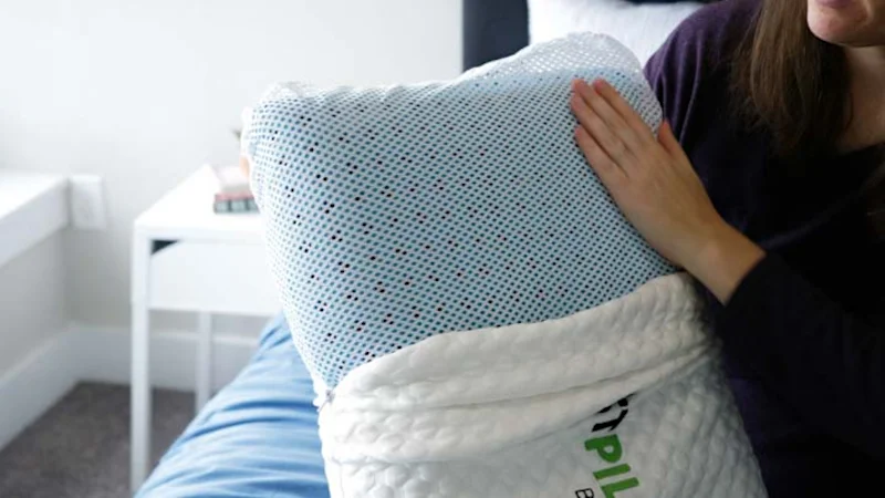 A person holding up a Ghostpillow