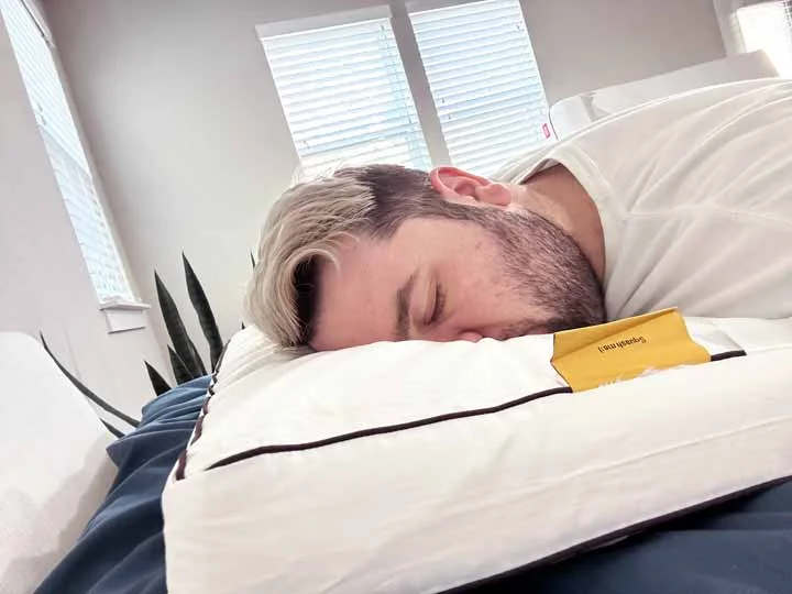 An image of a man sleeping on his stomach while using the Nolah Cooling Foam pillow. An image of a man sleeping on his stomach while using the Nolah Cooling Foam pillow.