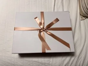 A Saatva Organic Sateen Sheet Set in the packaging